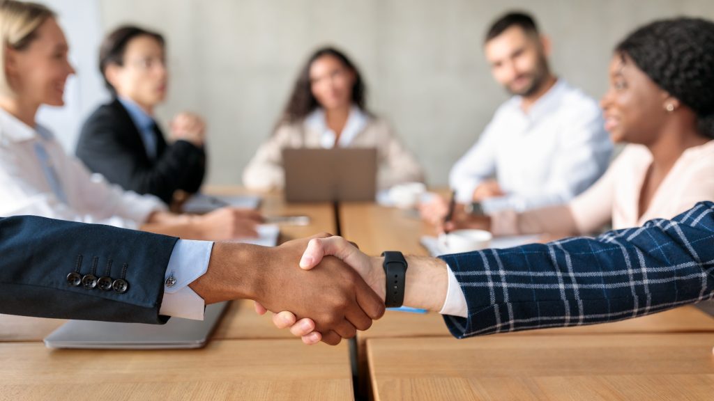 Closeup of a handshake at a corporate meeting